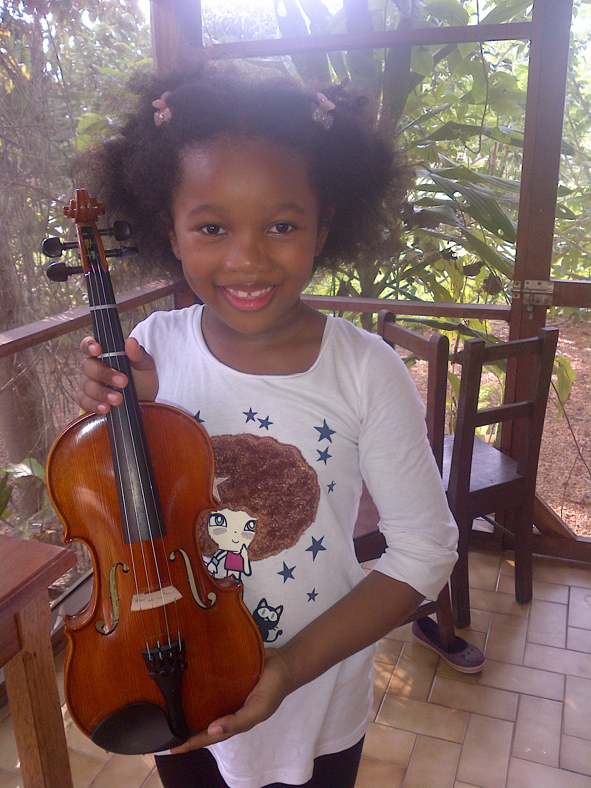 The day Cherissa received her violin and found out that Kate would teach her